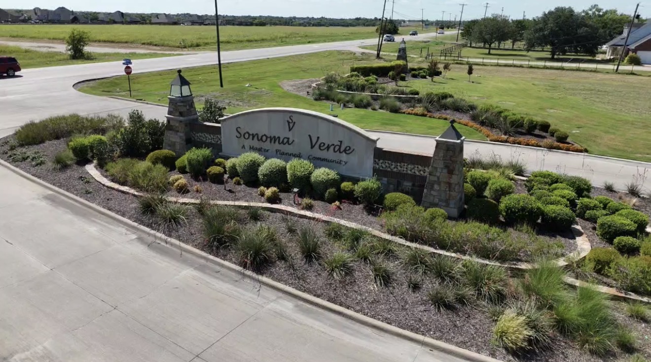 Aerial view of the Sonoma Verde, A Master Planned Community entrance sign in Rockwall, Texas