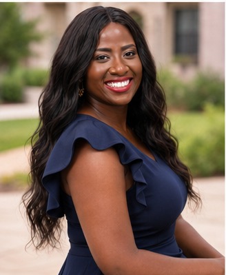 Tola Adebiyi in a navy ruffle dress outdoors