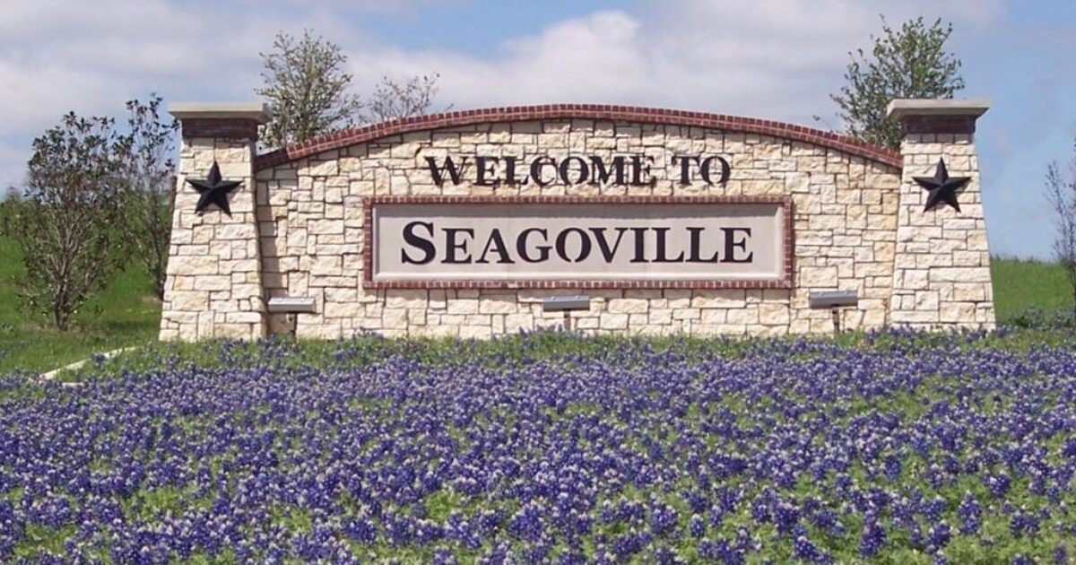 Welcome to Seagoville stone monument sign surrounded by Texas bluebonnets
