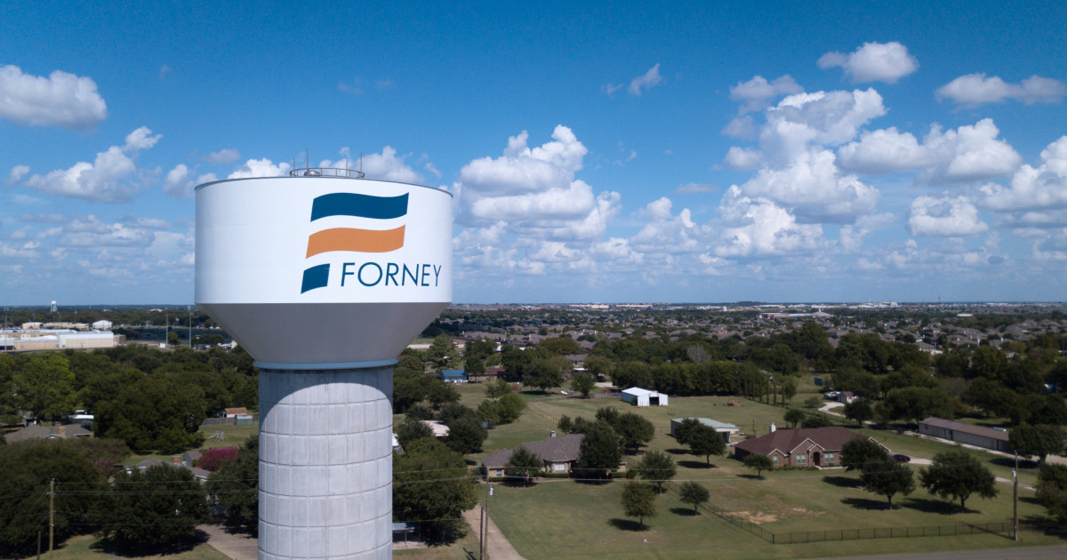 Aerial view of the City of Forney water tower above Forney, Texas neighborhoods