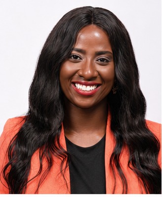 Tola Adebiyi in an orange blazer, professional headshot